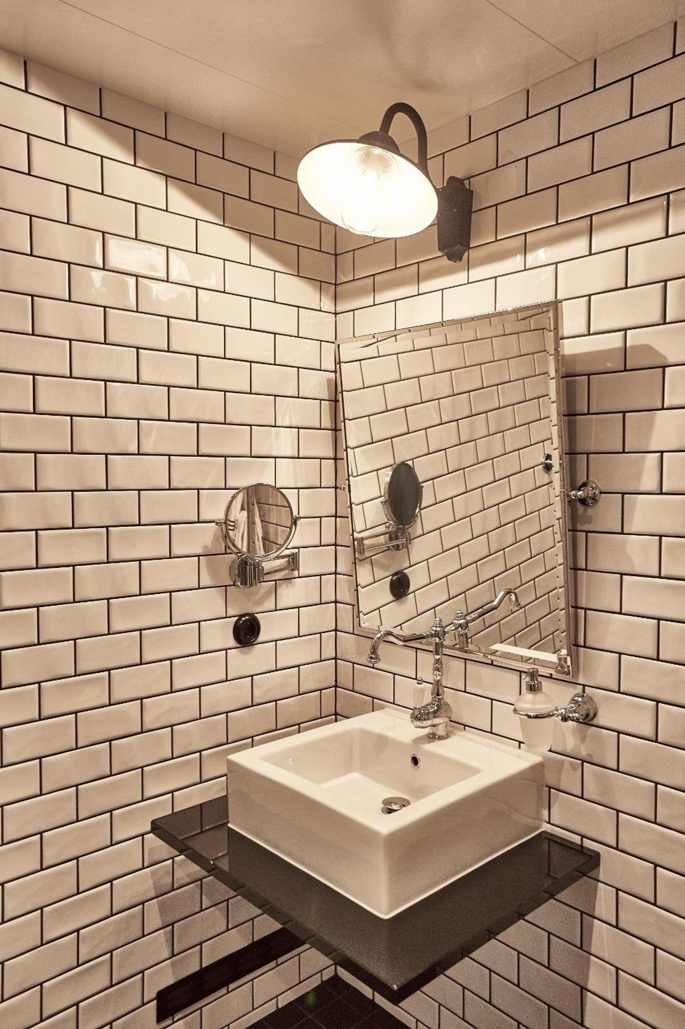 Steam Hotel Vasteras Exterior photo Subway tiles in a bathroom